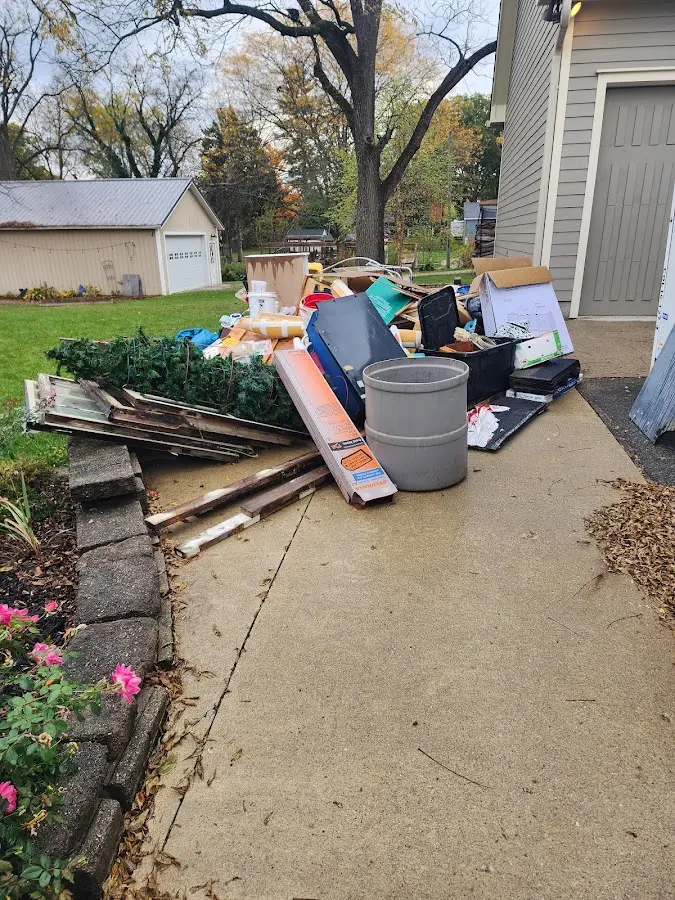 Dumpster being loaded with debris for 30 Yard Dumpster Rental in Grantham